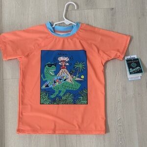 Kids Neon Orange Rash Guard with Surf Dino Graphic